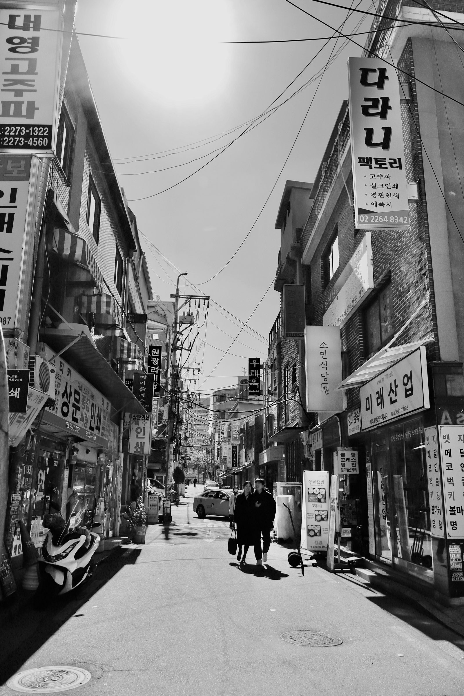 Backstreet, midday sun.