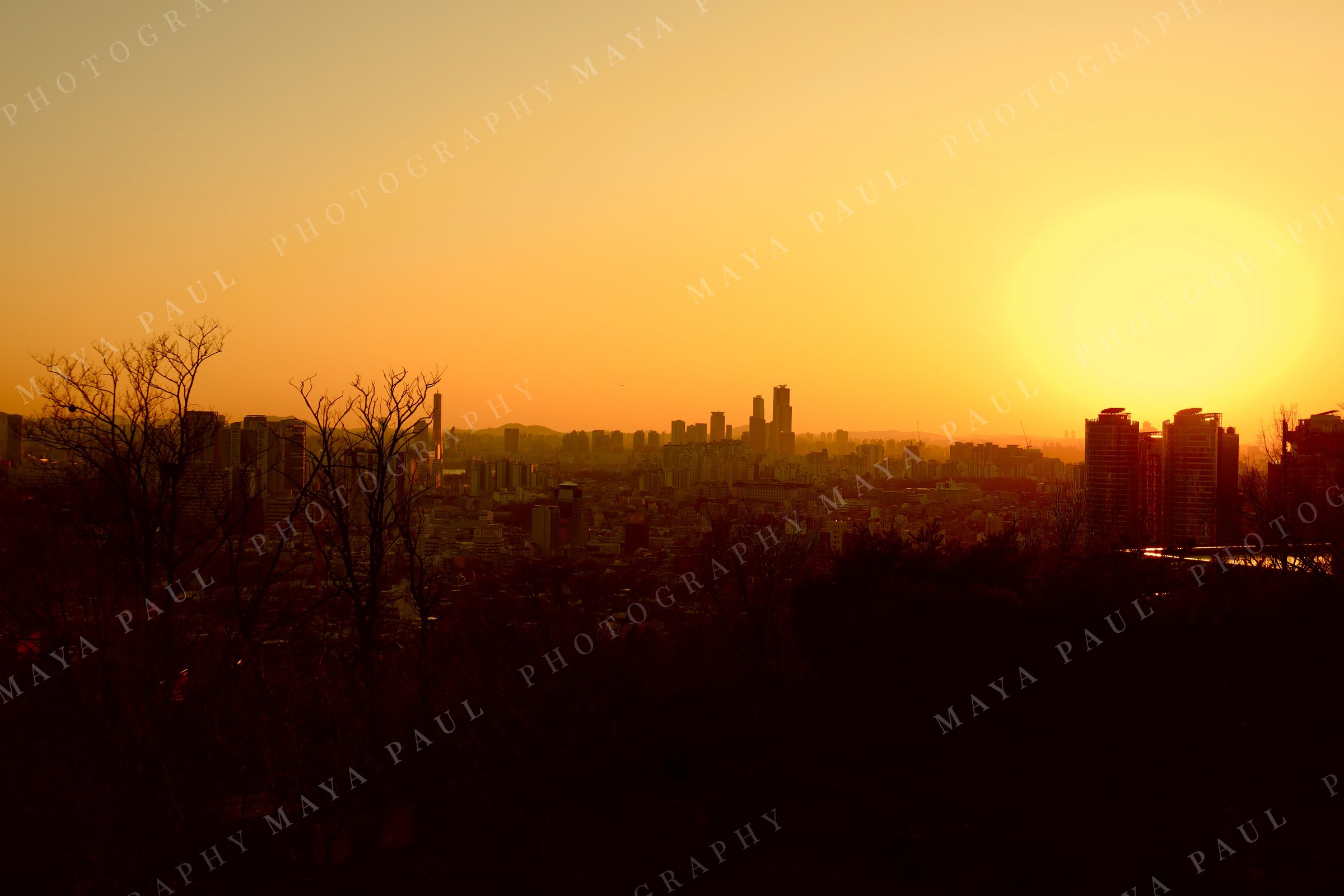 Seoul skyline silhouetted at sunset, South Korea.