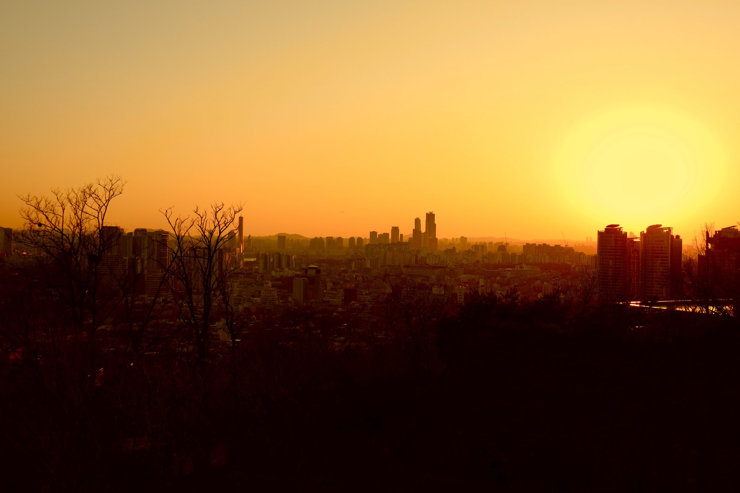 Seoul skyline silhouetted at sunset, South Korea.